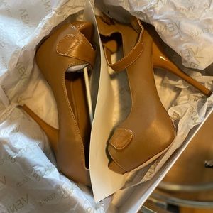 Brand new tan colored heels. Size 8